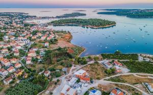 an aerial view of a city and the water at Villa RougeMarin - Rouge with private pool in Medulin