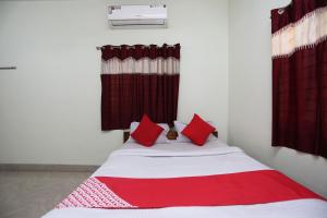 Postel nebo postele na pokoji v ubytování Super Hotel O Nandi Inn