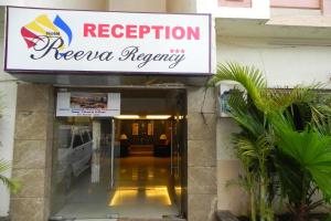a sign for the reception of a hotel at Reeva Regency in Shirdi