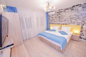 Ένα ή περισσότερα κρεβάτια σε δωμάτιο στο Tower by Grand Accommodation