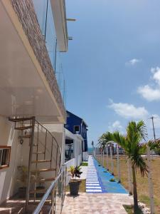 a stairway leading up to a beach house at apartamentos miss nicole in San Andrés