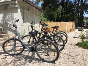 a group of bikes parked next to a building at ribeira dos marinheiros amarelo in Sintra