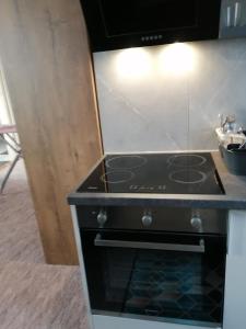 A kitchen or kitchenette at APARTMÁNY PIETRO