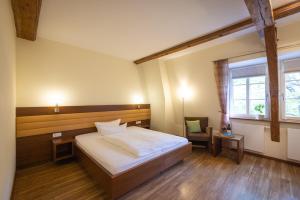 Postel nebo postele na pokoji v ubytování Altstadthof Freinsheim