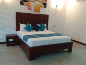 A bed or beds in a room at Anantamaa Hotel