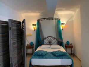 a bedroom with a bed with a canopy at A Furtezza in Soveria