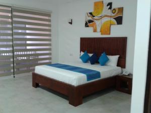 A bed or beds in a room at Anantamaa Hotel