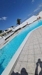a view of a swimming pool in front of a resort at Casa Eowyn in Puerto del Carmen