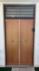 a pair of wooden doors in a building at Truly Apulia in Bari