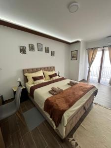 a bedroom with a large bed in a room at Apartman S2 in Ostrovo
