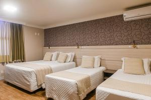 Postel nebo postele na pokoji v ubytování Hotel Pousada Kaster