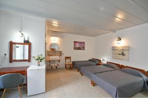 Postel nebo postele na pokoji v ubytování Delfini Hotel