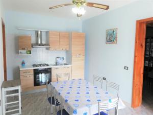 Kuchyň nebo kuchyňský kout v ubytování 054 e 055 Spiaggia direttamente sulla spiaggia di SalentoInVacanza.Com
