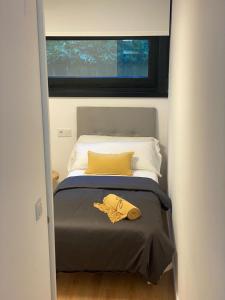 เตียงในห้องที่ Nomads Hosting Alojamientos