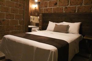 Letto o letti in una camera di Hotel Real Nirvana
