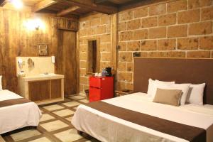 Postel nebo postele na pokoji v ubytování Hotel Real Nirvana