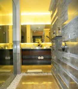 a bathroom with a tub and a sink at Villa Ava Seminyak Bali in Seminyak