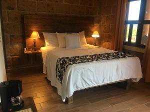 Postel nebo postele na pokoji v ubytování Hotel Real Nirvana + 37 fotografií