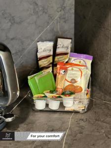 a pile of food sitting on top of a table at Newly Refurbished Luxury Hotel Style Accommodation in Milton Keynes