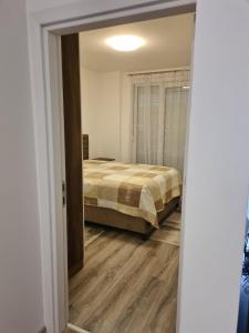 Postel nebo postele na pokoji v ubytování Fush Kosov Apartment Center