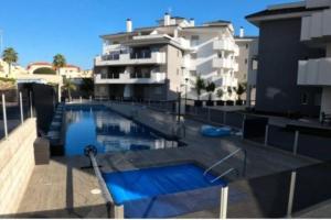 a large swimming pool in front of a building at Sun-Golf-Beach Villamartin in Alicante