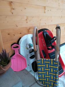a bag of ski equipment sitting next to a wall at Ferienhaus-Eisenerz in Eisenerz