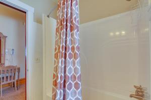 a curtain is hanging in a room with a door at Beautiful Historic Home Near Bryce Canyon! in Cannonville +21 photos