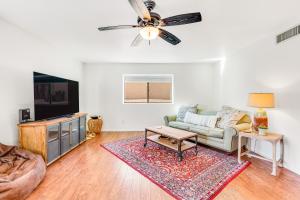 a living room with a couch and a tv at Laurel Wood in Oro Valley