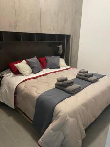 Säng eller sängar i ett rum på La Casa di Pegli 21r
