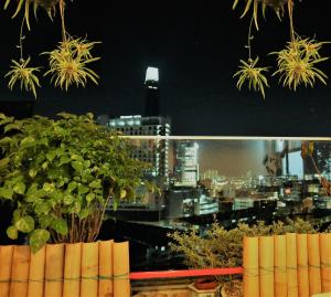 a view of a city skyline at night at Xpeed Holiday Hotel in Kuala Lumpur