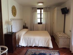 a bedroom with a bed and a window at B&B Il Portico in Sarzana +59 photos