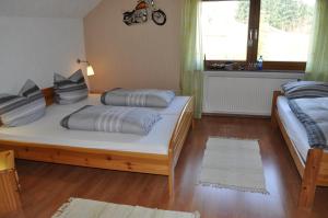 
Ein Bett oder Betten in einem Zimmer der Unterkunft Pension Jonas
