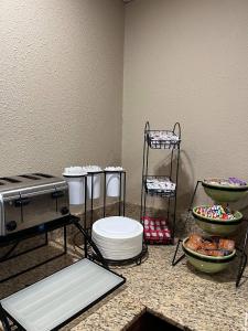 a bathroom with a toilet and bowls of food at Quality Inn & Suites Bradford in Bradford