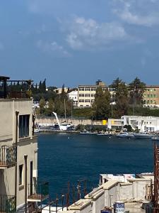 a view of a body of water with buildings at Romantica in Brindisi