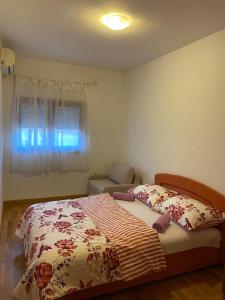 a bedroom with a bed and a window at Spirit 3 in Međugorje