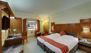 Postel nebo postele na pokoji v ubytování Hotel Amar