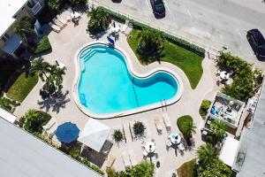 an overhead view of a swimming pool at a resort at 805 - Friendly Native Beach Resort in St. Pete Beach
