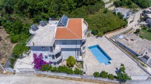 an overhead view of a house with a swimming pool at Villa Erik in Ulcinj
