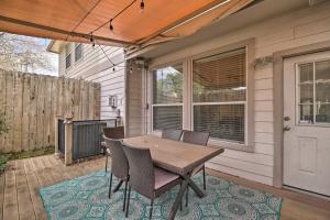 a patio with a table and chairs on a porch at River Oaks 4BD Home Walkable to Whole Foods & Eateries in Houston