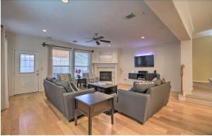 a living room with two couches and a fireplace at River Oaks 4BD Home Walkable to Whole Foods & Eateries in Houston