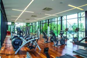a gym with a bunch of treadmills and elliptical machines at Cosy128 @The Shore 3R2B 8-10pax 5mins to Jonker in Malacca