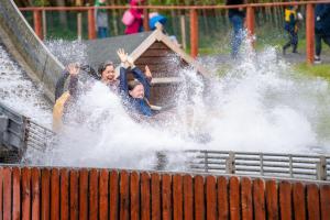 two people riding a roller coaster in the water at Westport Estate Glamping Village in Westport