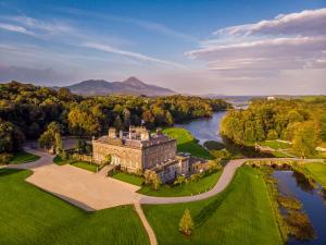 an aerial view of a castle and a river at Westport Estate Glamping Village in Westport