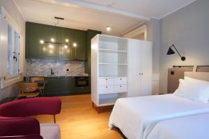 Cama ou camas em um quarto em Hotel da Oliveira
