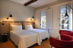 Cama ou camas em um quarto em Hotel da Oliveira