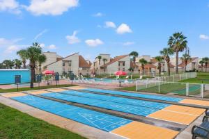 a swimming pool at a resort at Chic Townhouse Steps to the Beach Outdoor Pools in Panama City Beach