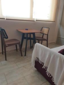 A seating area at Tiny studio 2 min walking distance from the port