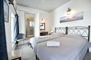 Postel nebo postele na pokoji v ubytování Delfini Hotel