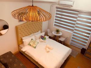 Katil atau katil-katil dalam bilik di Studio Unit for Staycation with Wi-Fi & Netflix near BGC, Taguig - Additional P150 per head for Pool Access