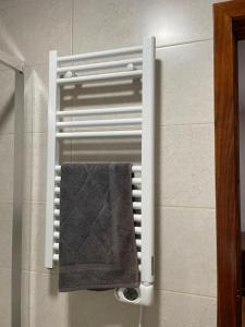 a towel rack in a bathroom with a towel at CASA BRIGIDA in Jerte +40 photos